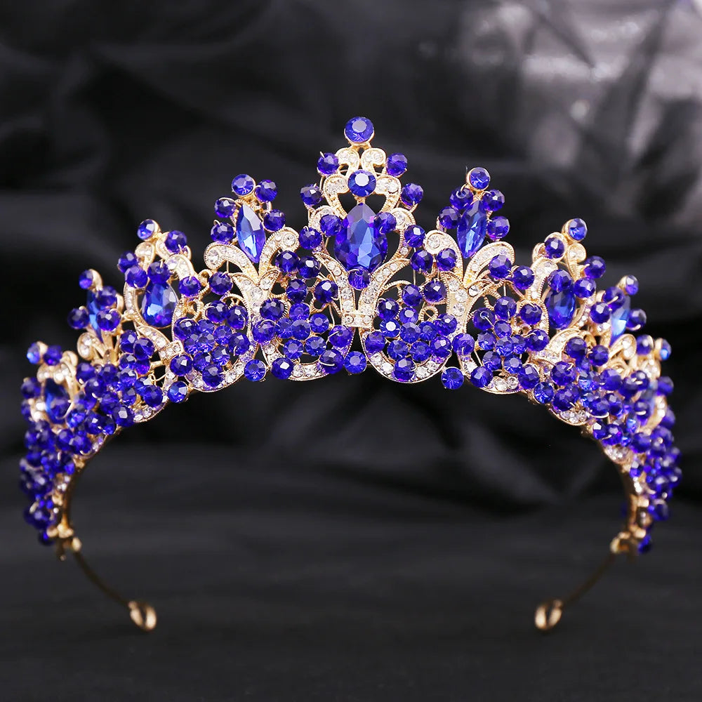 Royal blue crystal tiara crown with faceted gemstones and raised central motif