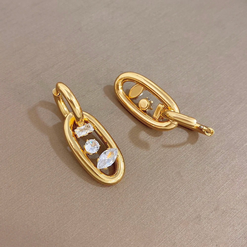 Gold-plated hoop earrings with zircon drop detailing, side view