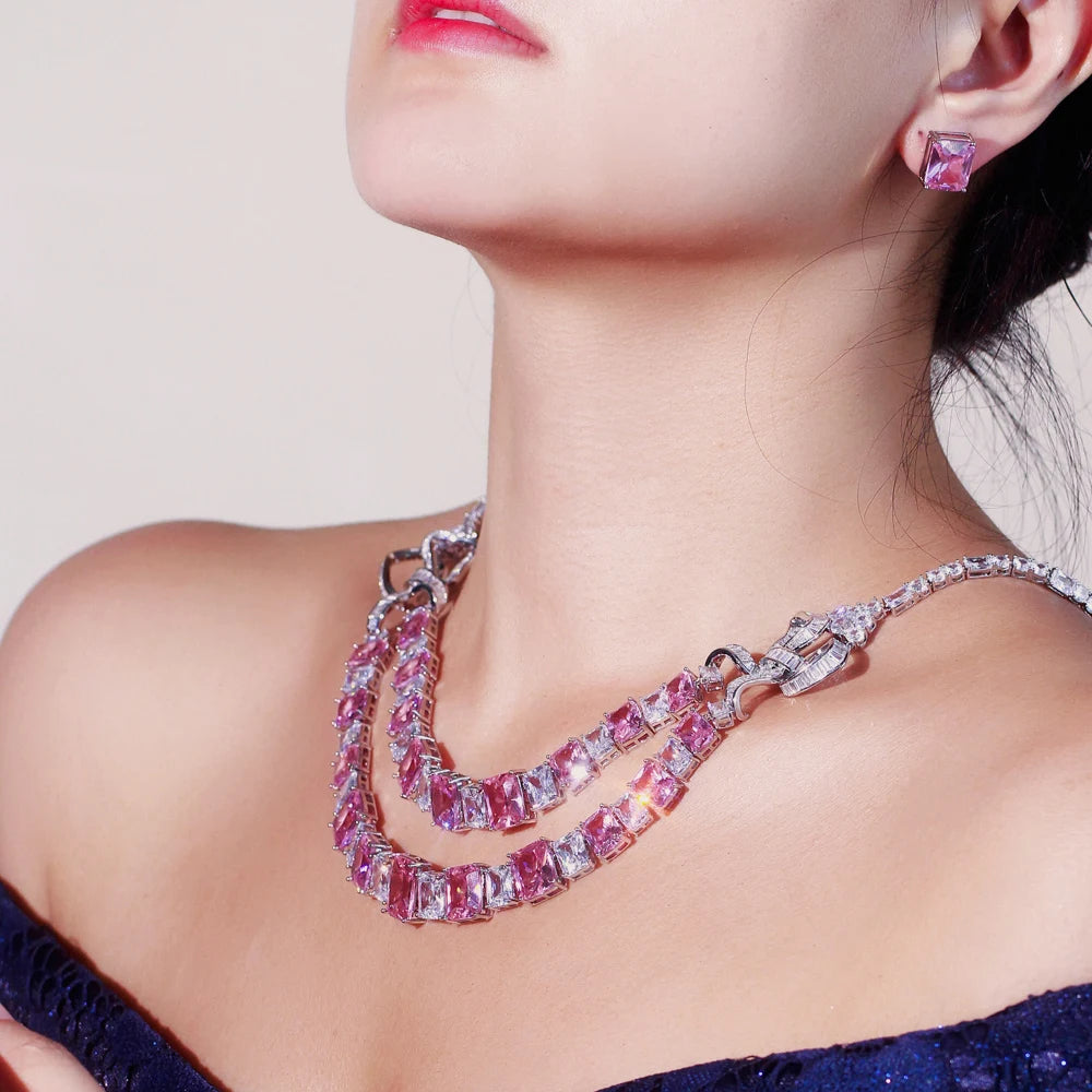 Pink square-stone necklace and matching stud earring shown worn from the side