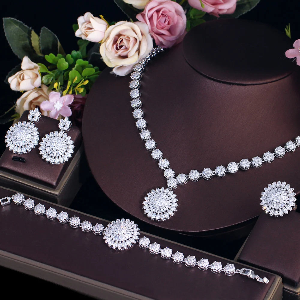 Sunflower zirconia jewelry set: necklace with heart-shaped stones, bracelet, drop stud earrings.