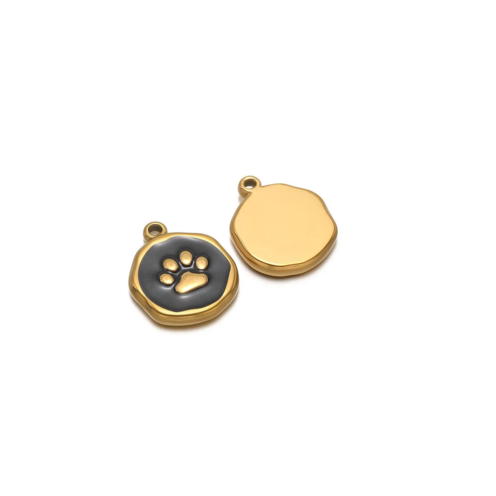 Gold-tone round charm with black paw-print enamel, plus blank gold-tone round charm
