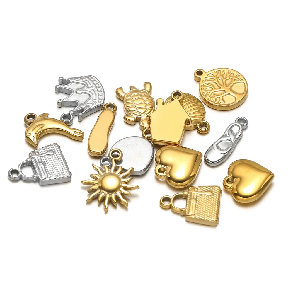Mixed gold and silver animal and star stainless steel charm set with hanging loops