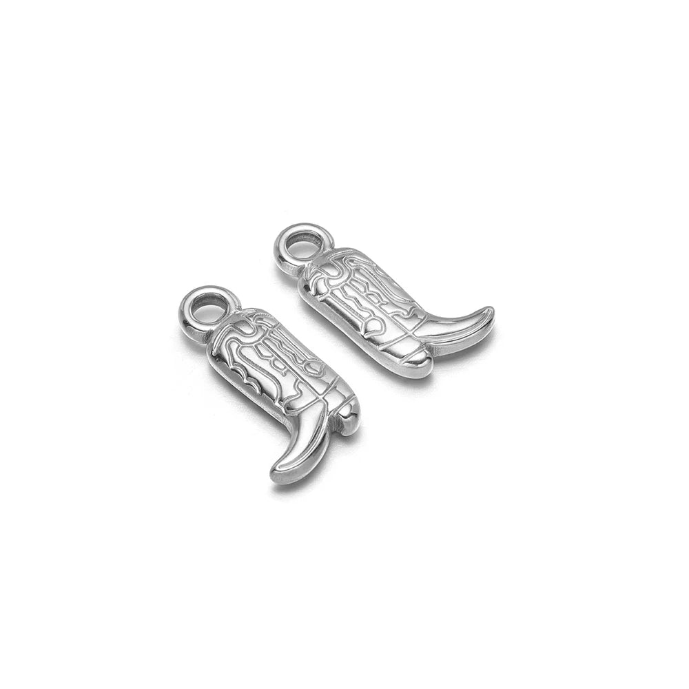 Silver-tone cowboy boot charm pendants with engraved detail, two pieces with loop bails