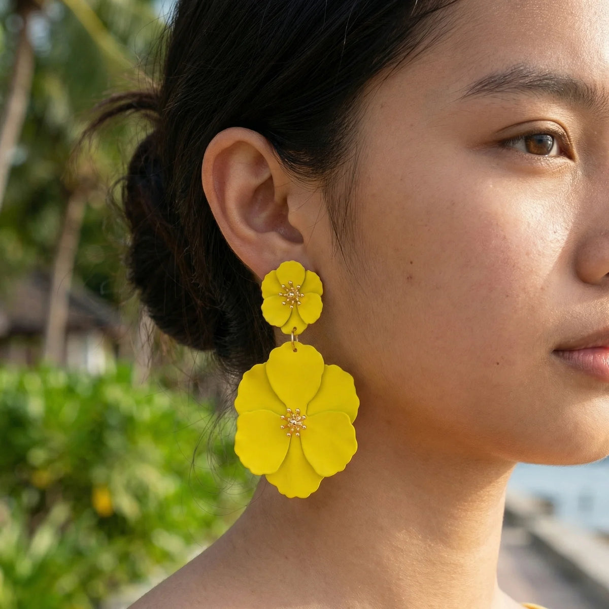 Yellow flower drop earrings with double floral drops and gold-tone center