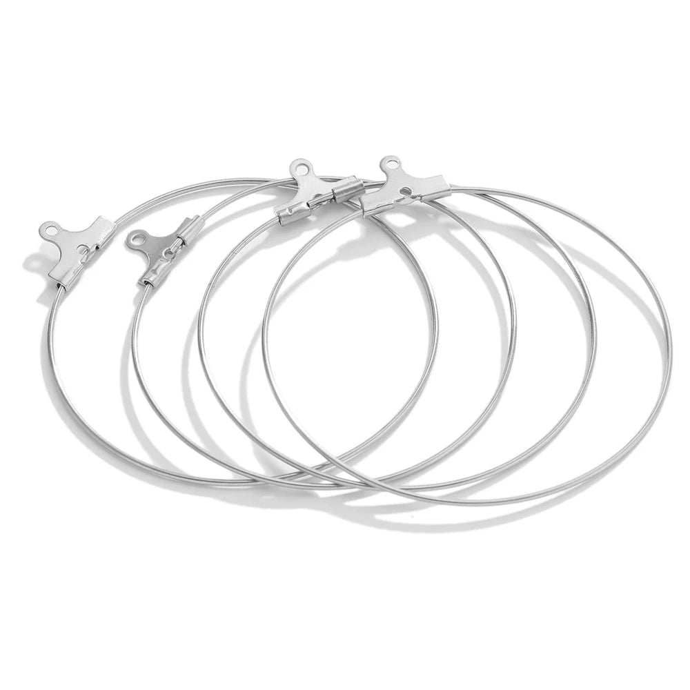 Silver hoop earring findings with clasp hooks, neatly arranged circular hoops set