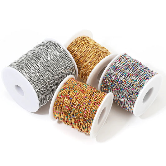 Beaded metal ball chain on spools: silver, gold, and colorful strand rolls