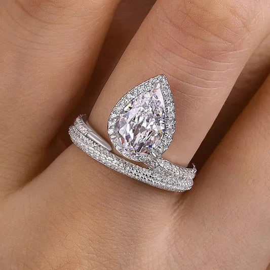 Pear-shaped cubic zirconia ring with double pavé band