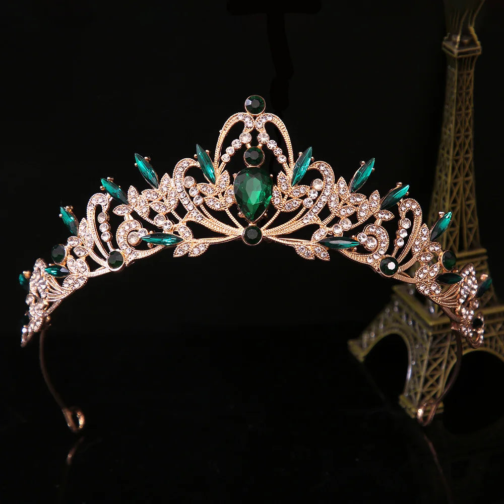 Jeweled bridal tiara crown with green center stone and teal accents, silver leaf scrollwork