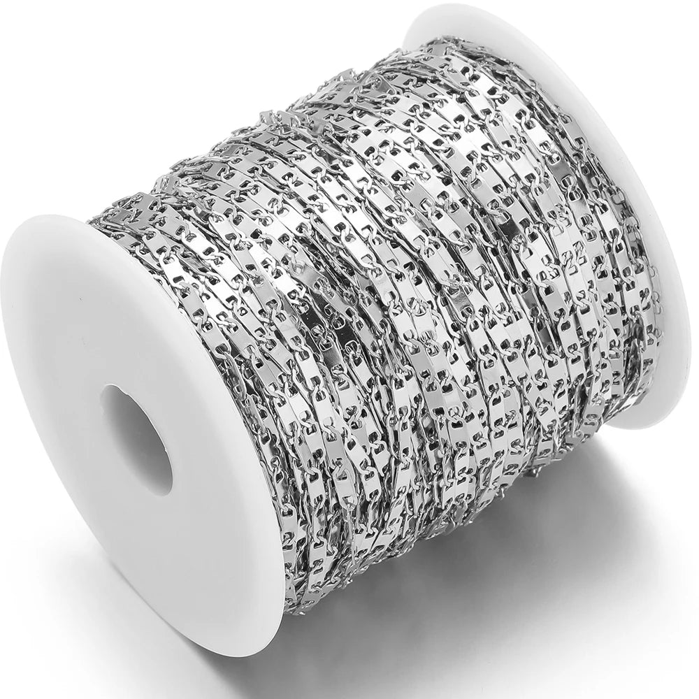 Silver flat link chain bulk spool with repeating rectangular link pattern