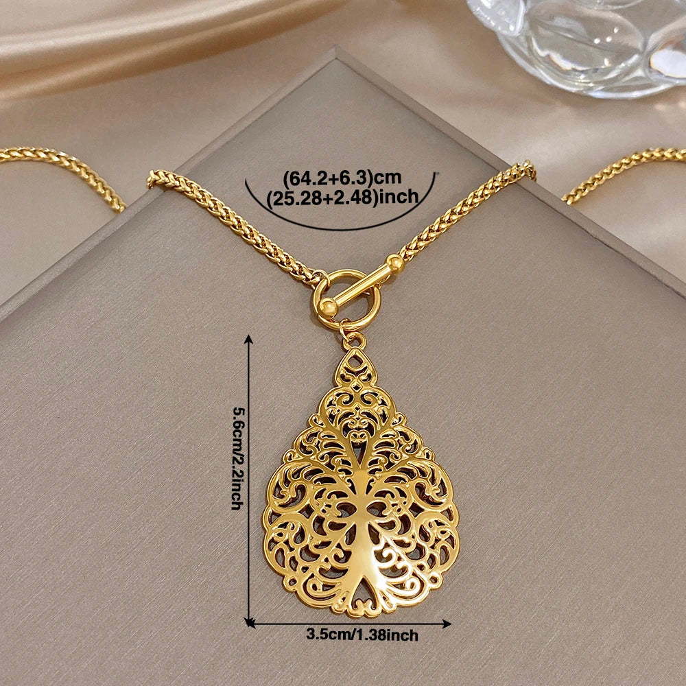 Gold-tone waterdrop filigree pendant necklace with size guide diagram