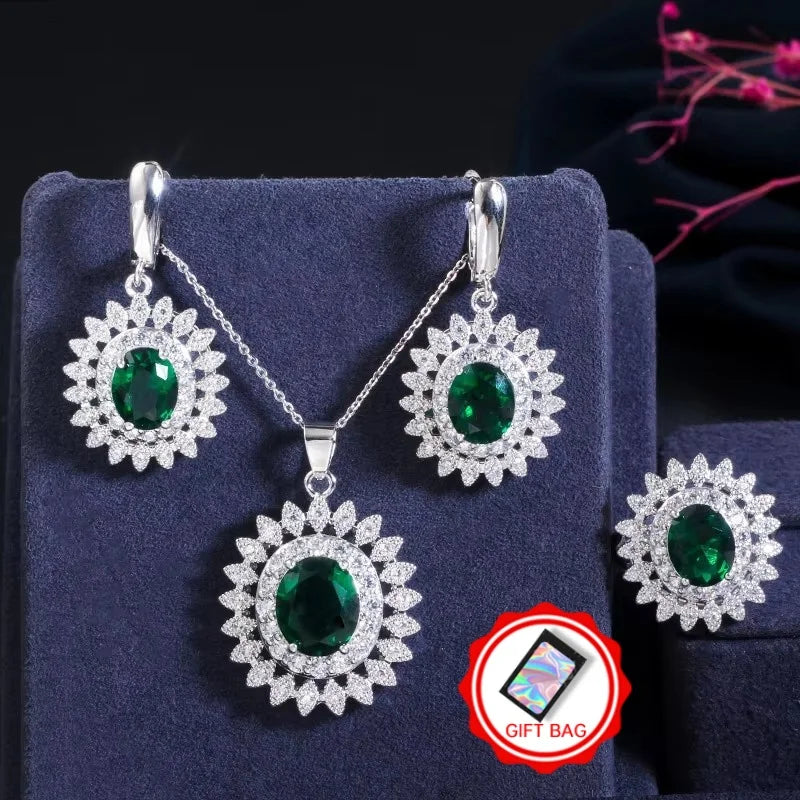 Green oval cubic zirconia jewelry set with flower-halo earrings, pendant necklace, and ring
