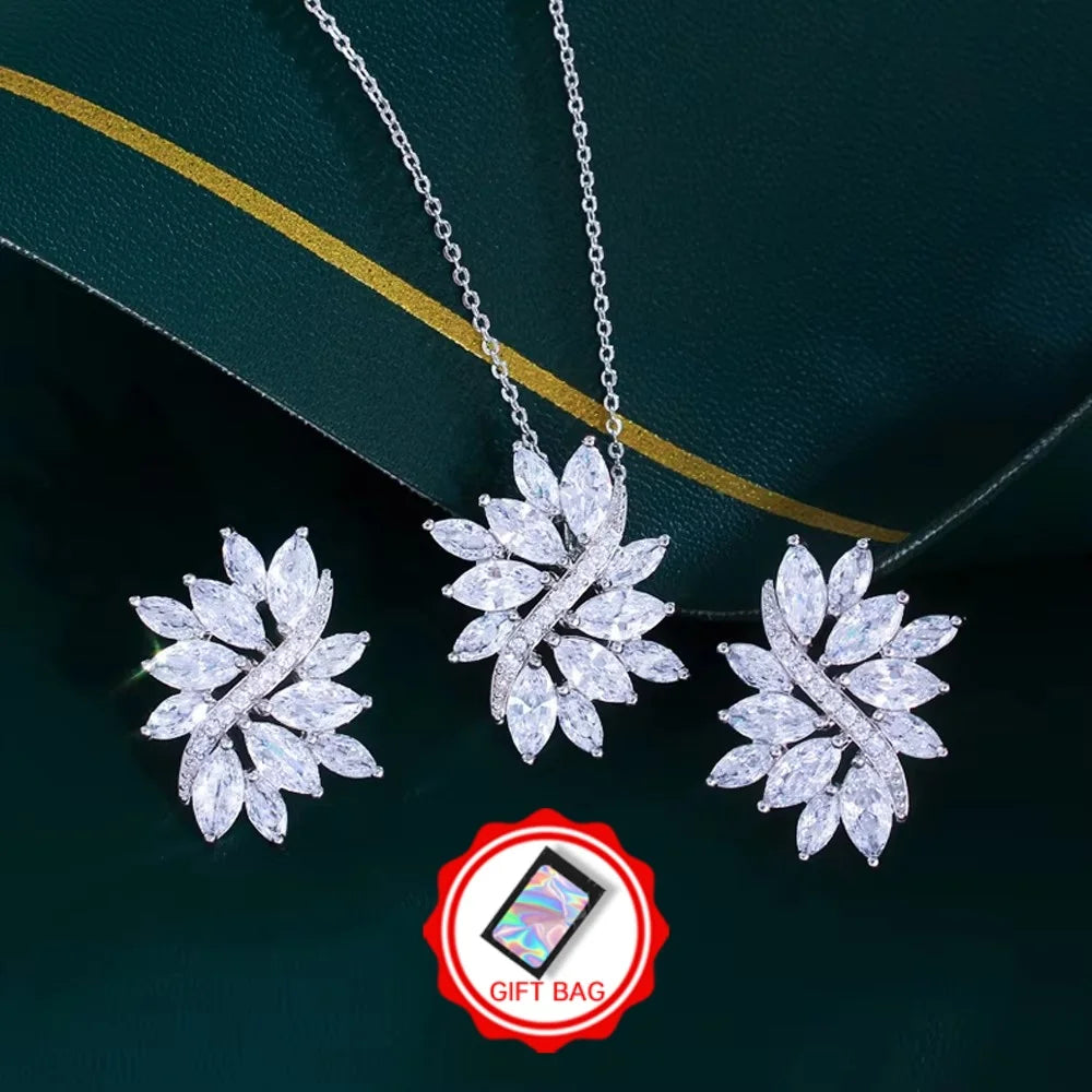 Silver-tone zirconia leaf jewelry set with matching earrings and necklace; gift bag shown