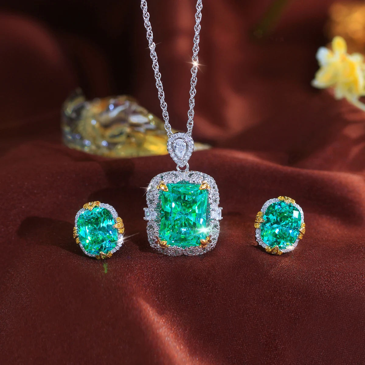Green crystal necklace and matching oval stud earrings with silver-tone settings