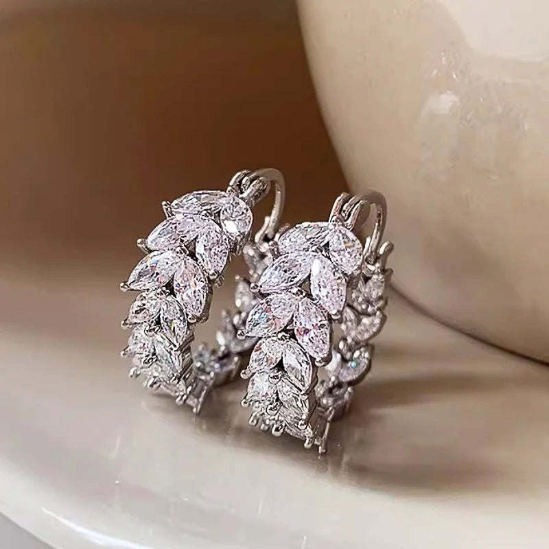 Silver cubic zirconia marquise hoop earrings with clustered stones, elegant curved hoops