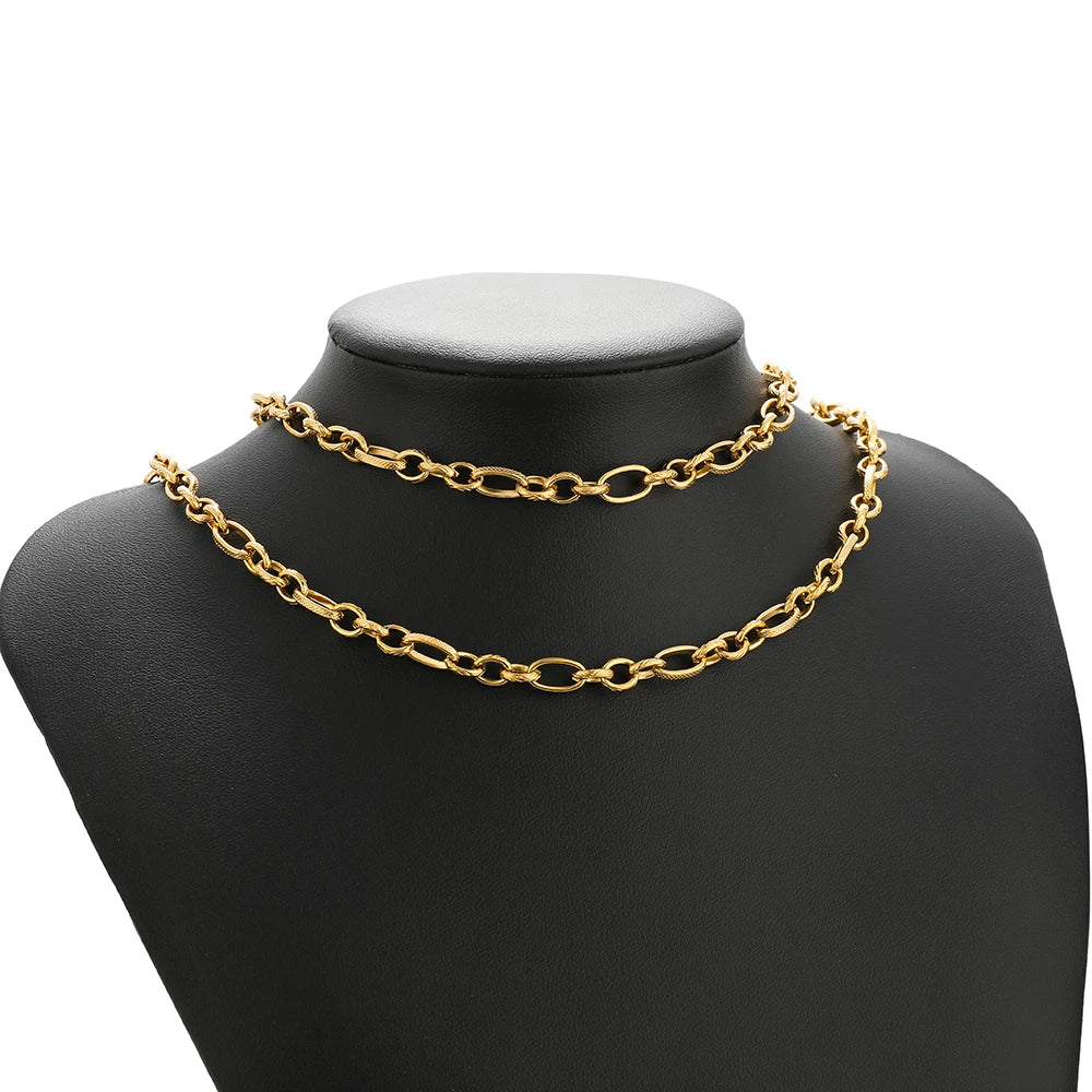Gold flat link chain necklace on black display bust
