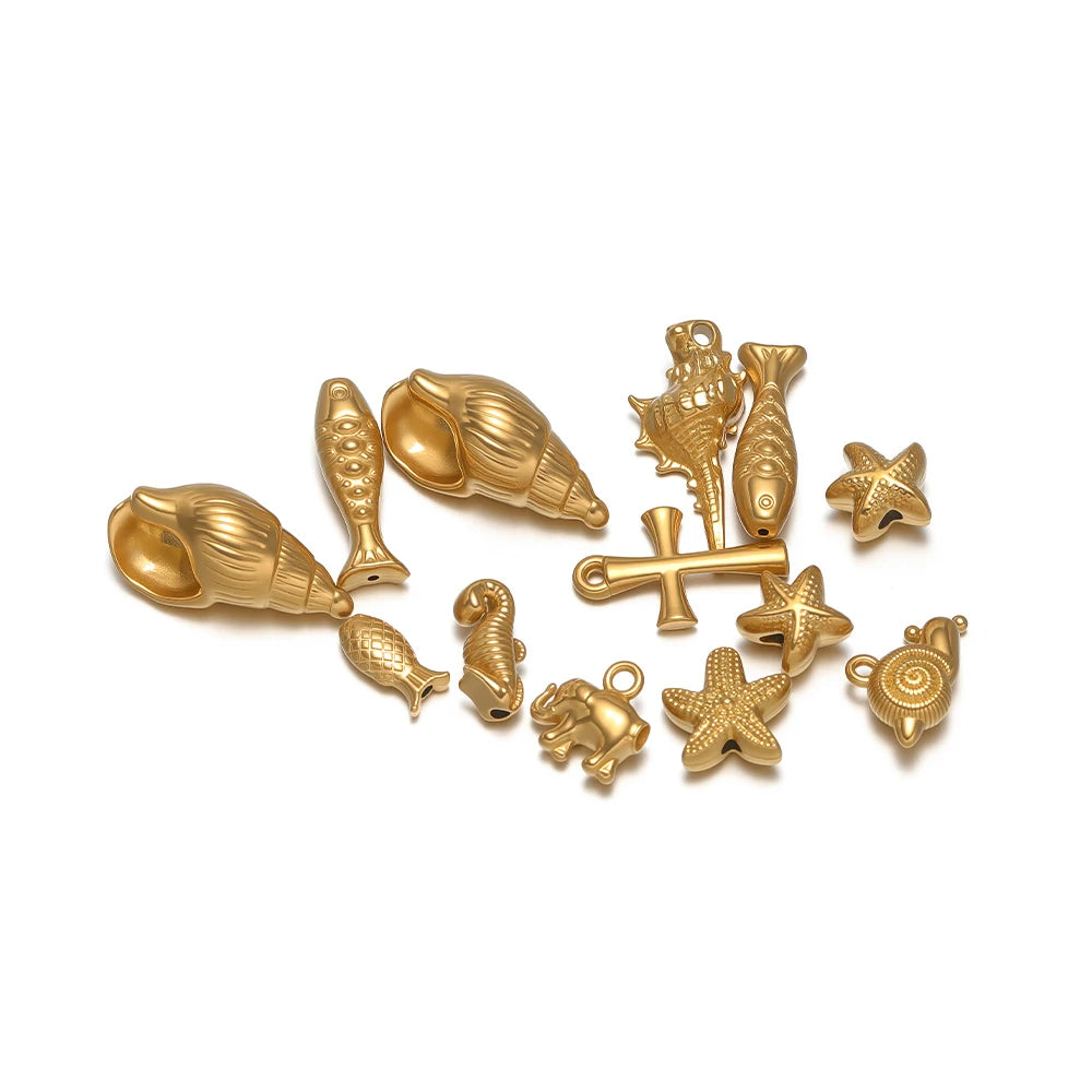 Gold-toned marine animal charms assortment, shells, starfish, elephant, crab and cross