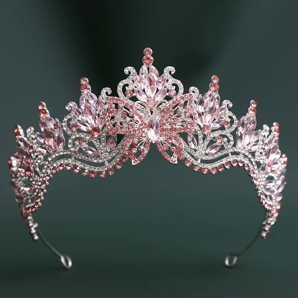 Pink crystal rhinestone tiara with large central gem and curved jeweled band