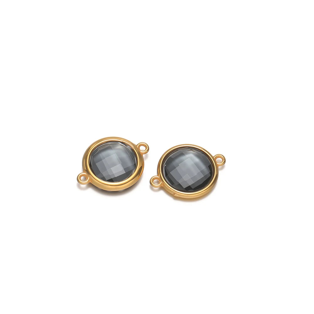 Round dark gray faceted glass charm pendants with gold-tone frames and loop hooks