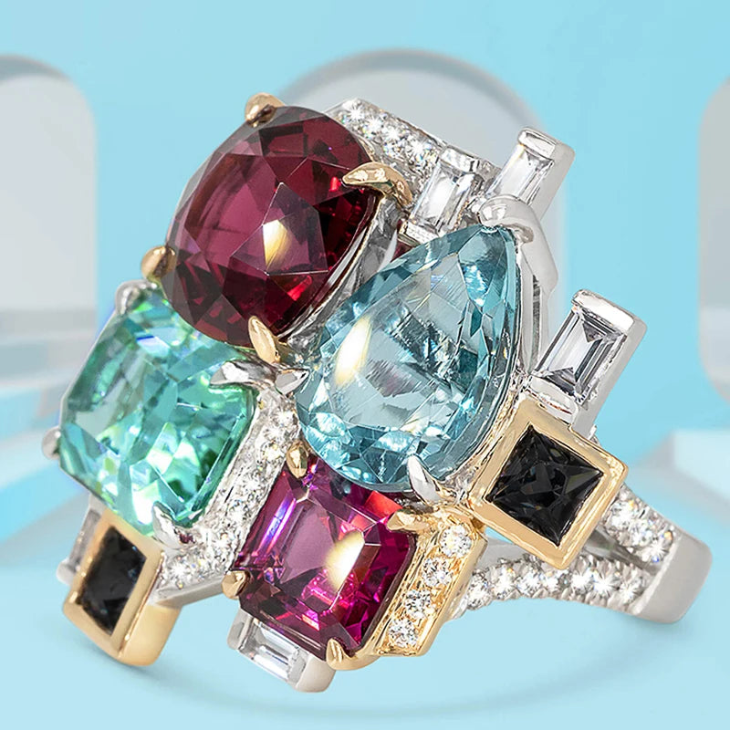 Two-tone cocktail ring with colorful faceted stones and clear accent stones