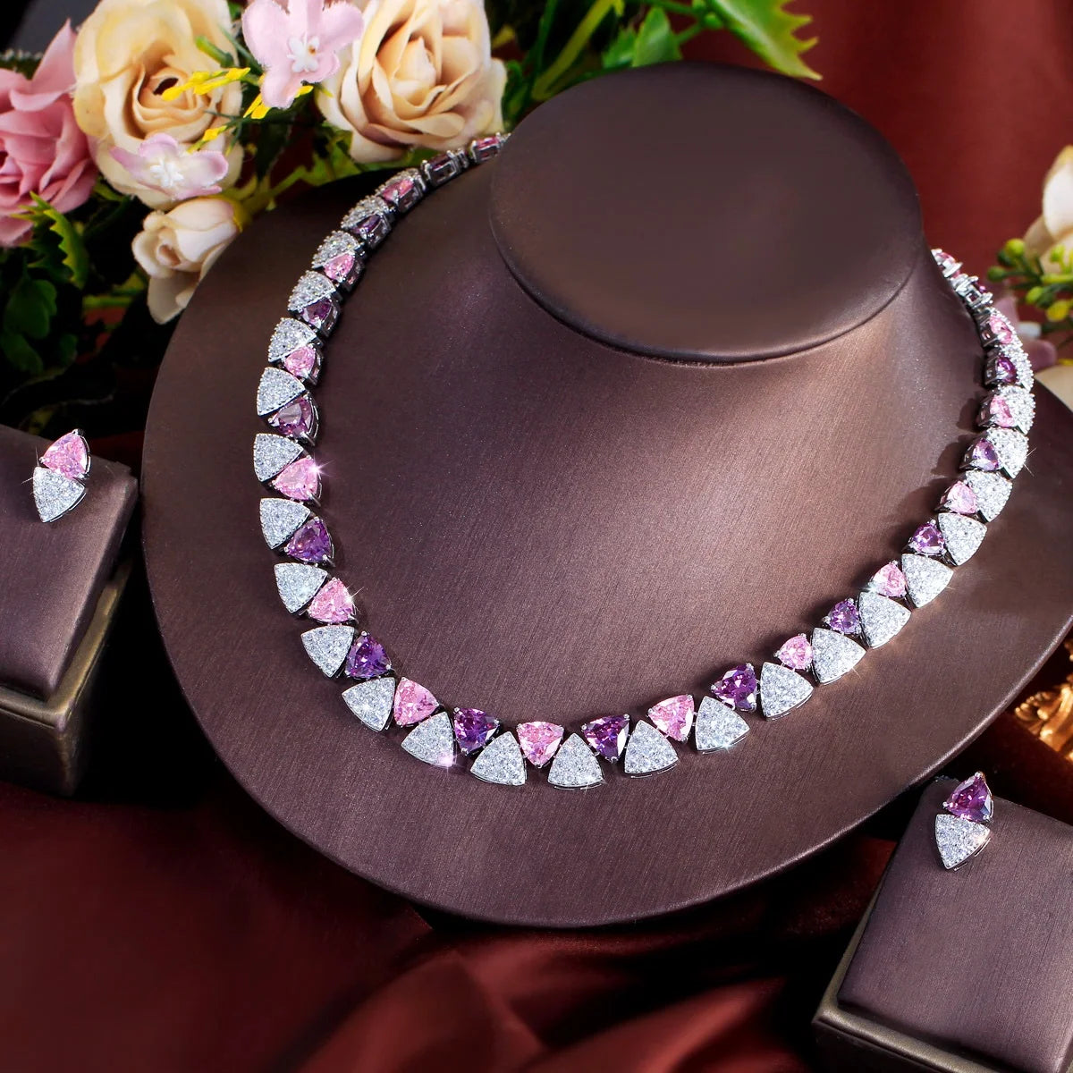 Purple, pink, and clear triangle cubic zirconia necklace and matching earrings