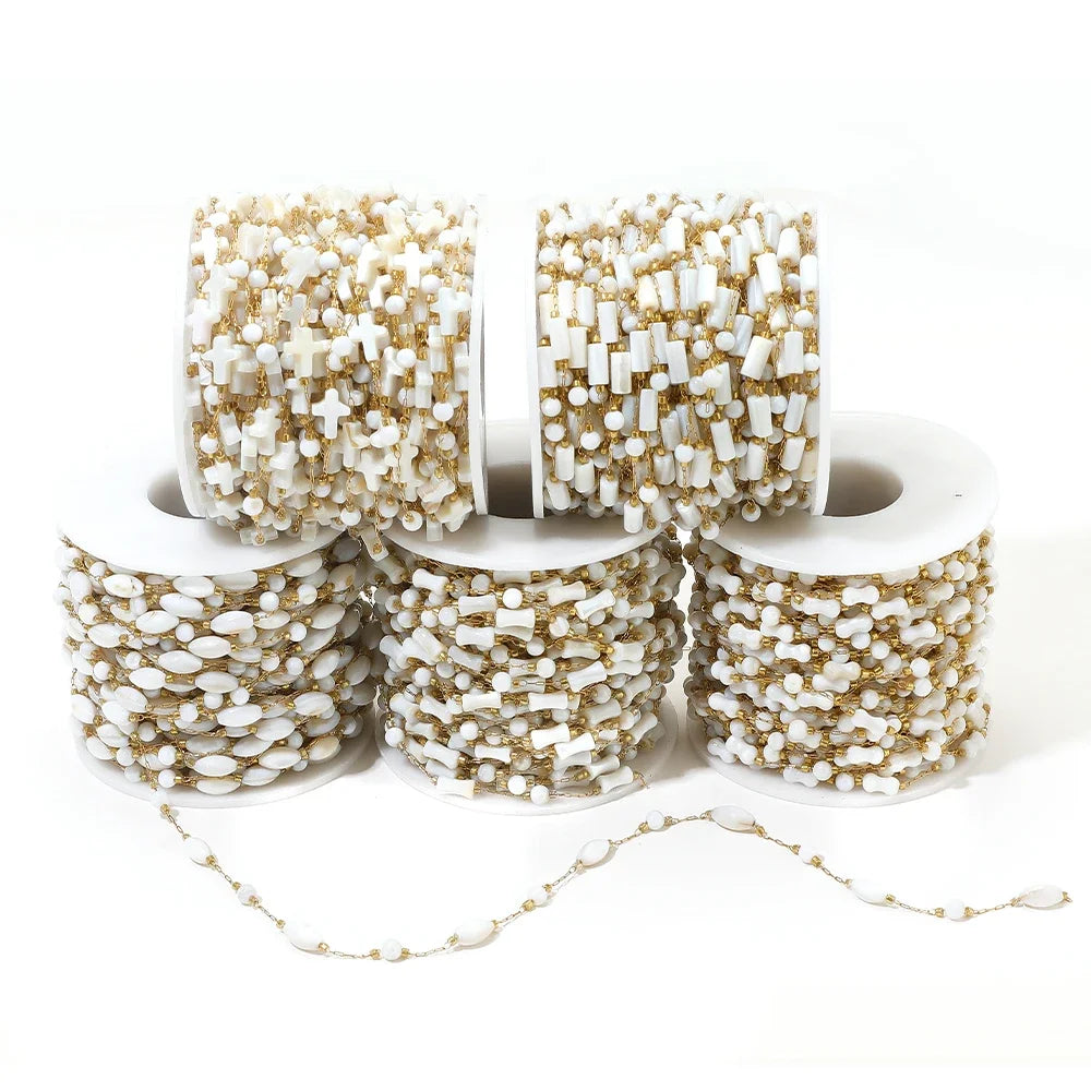 White-and-gold shell-style bead chain spools with a loose matching beaded strand