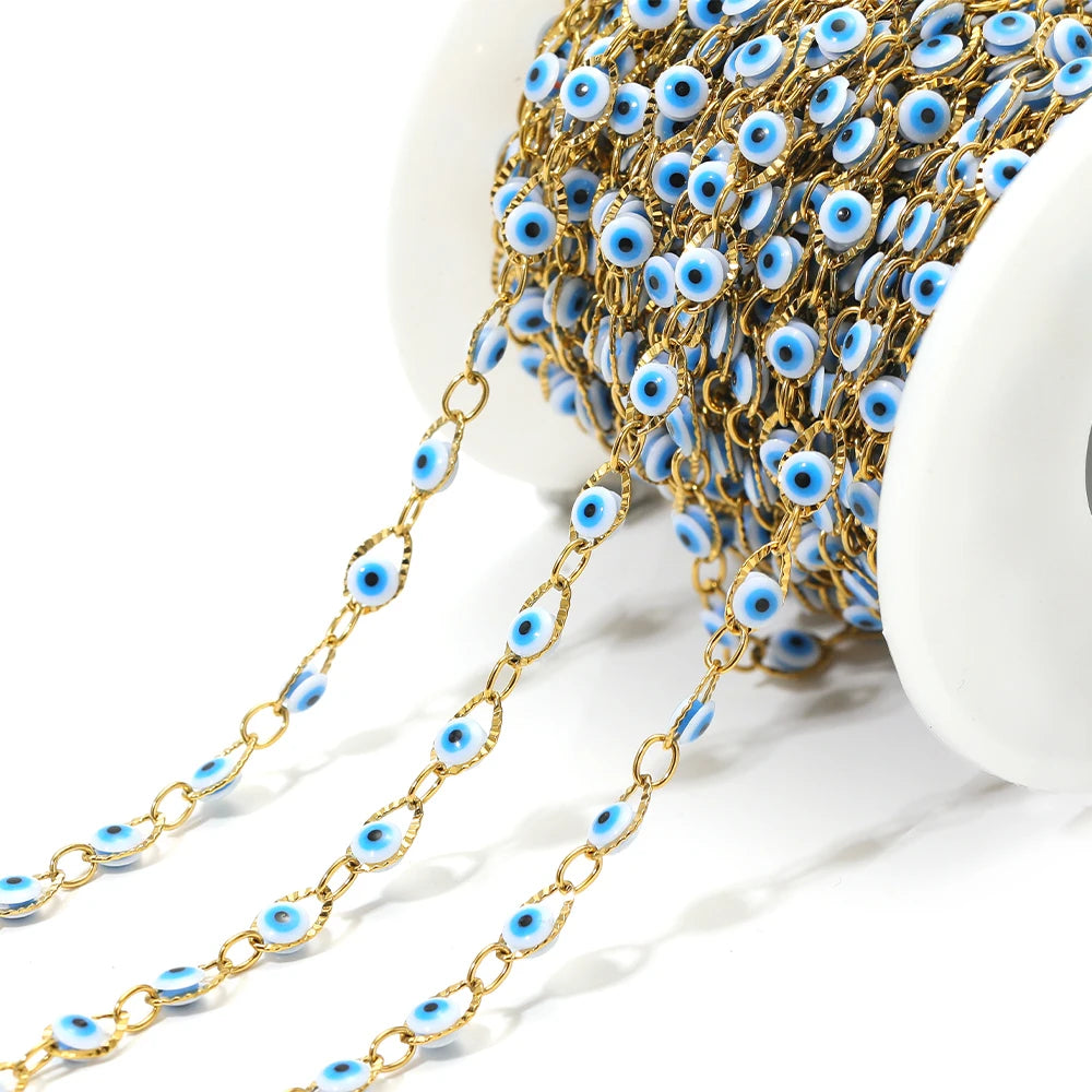 Gold-tone evil eye bead chain strand with blue oval eye beads on linked chain
