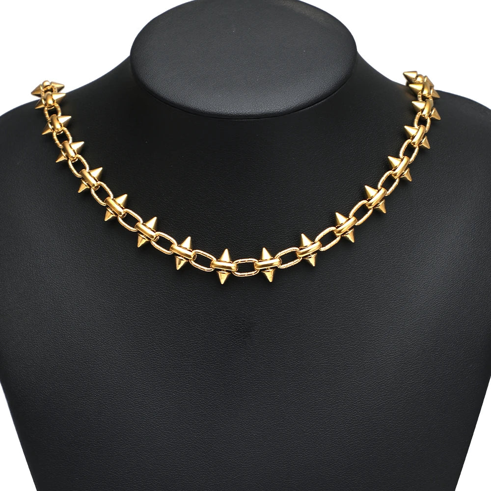 Gold bow knot chain necklace on a black mannequin bust