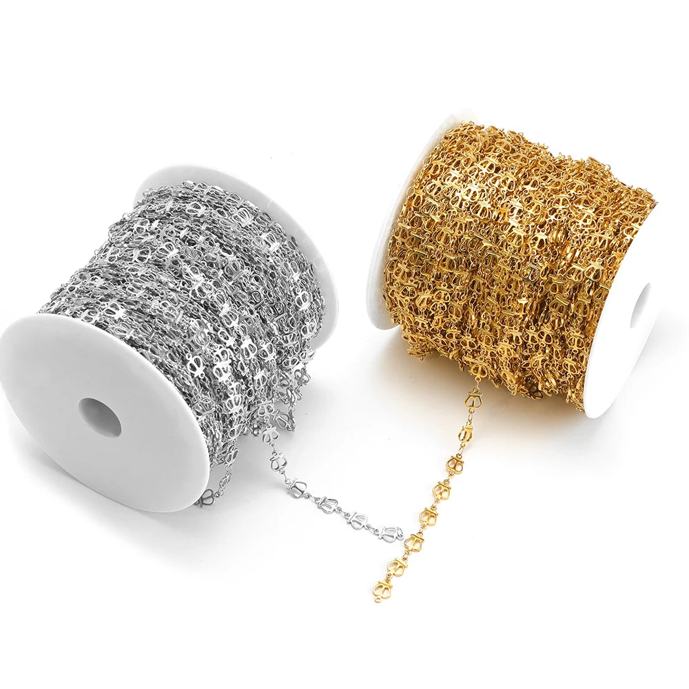 Silver and gold hollow chain spools with loop links on white storage reels