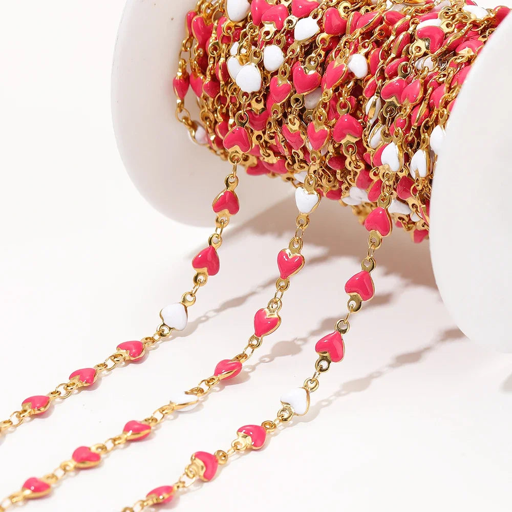 Gold-tone heart link chain with pink enamel heart charms and small stainless links