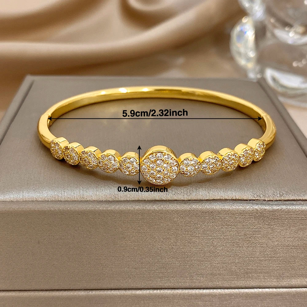Gold-plated zircon cuff bangle bracelet with round front detail