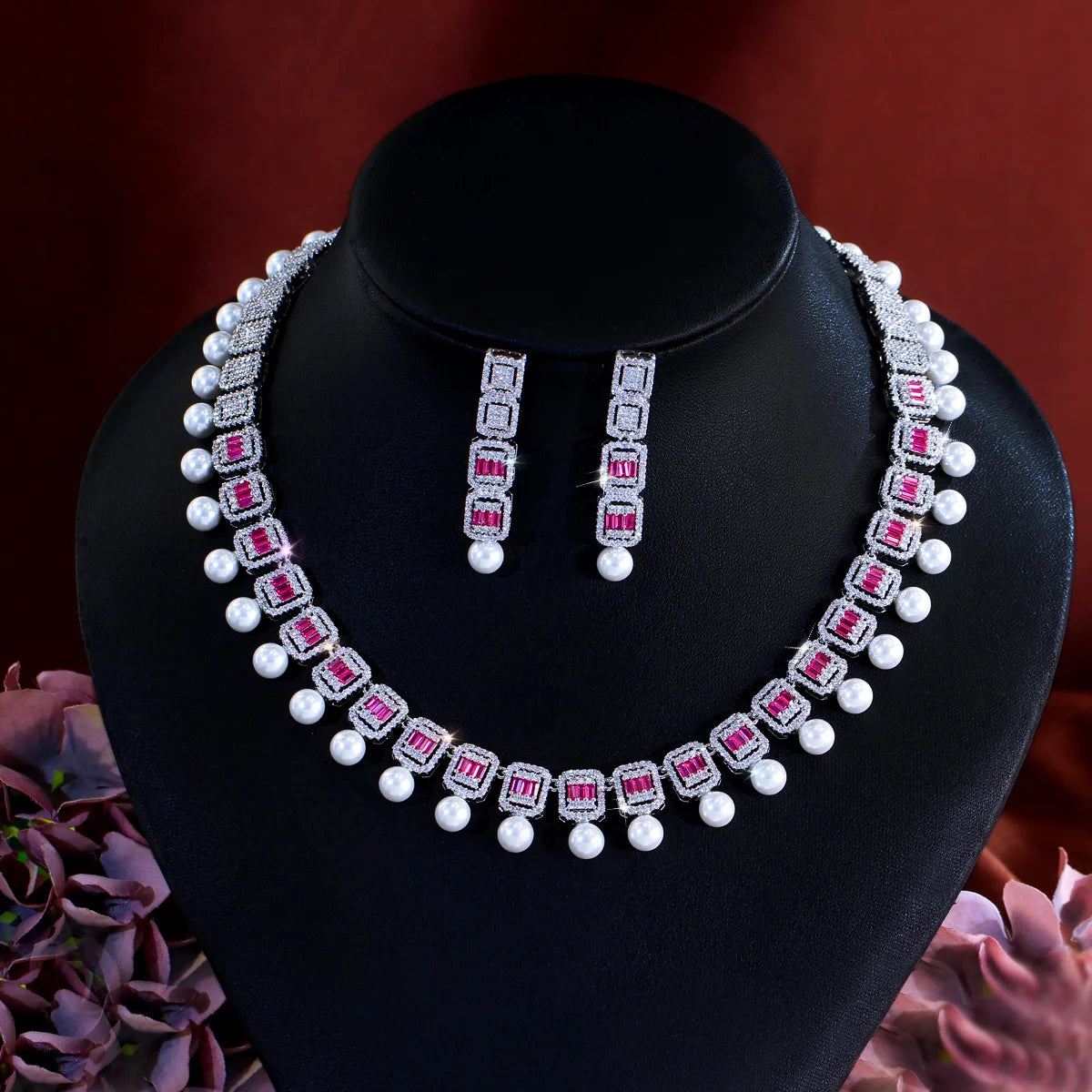 Geometric CZ necklace set with white pearl beads and rose-accent drop earrings
