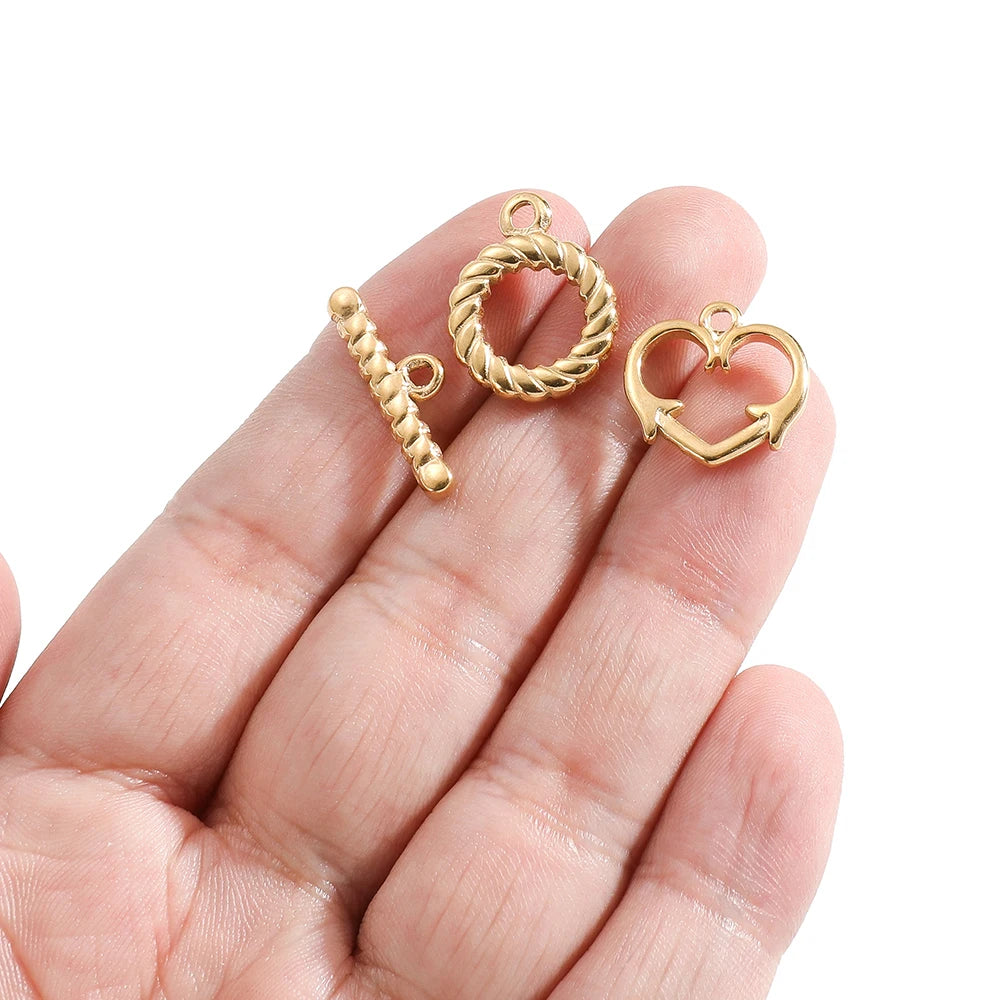 Gold heart toggle clasp with braided ring and straight bar connector pieces
