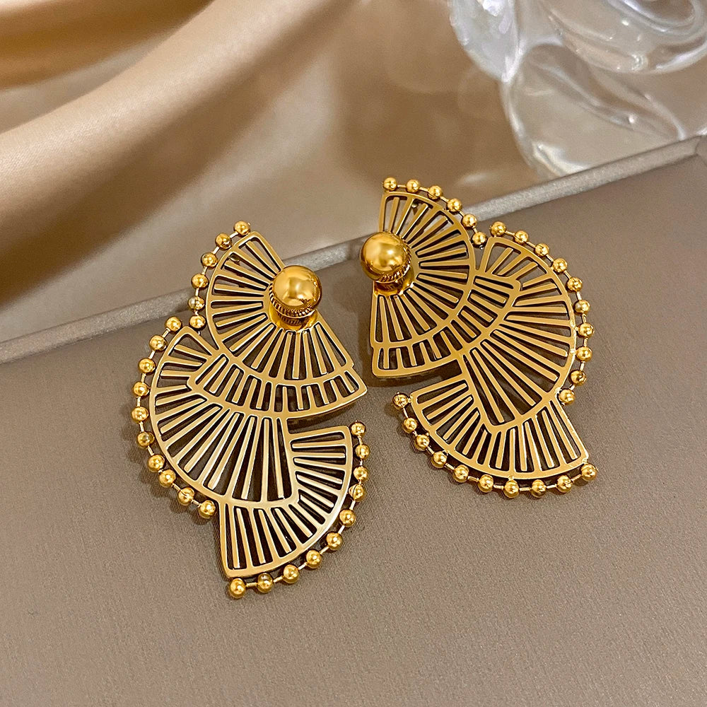 Pair of gold-tone geometric earrings with layered fan cutouts and bead borders