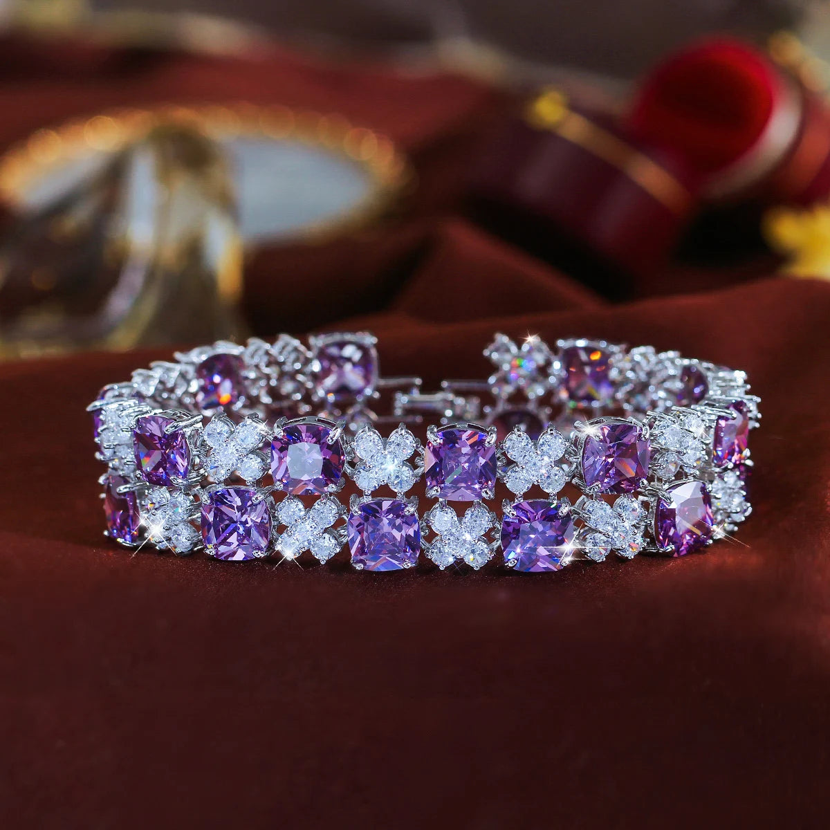 Purple and clear cubic zirconia flower tennis bracelet with a silver-tone setting