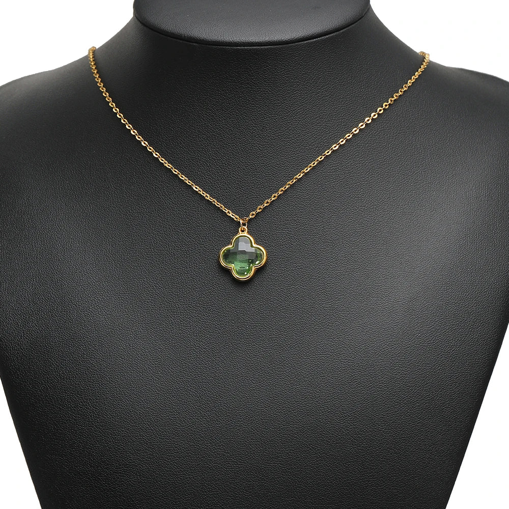 Clover glass pendant on a gold-tone chain, green stone with connector loop