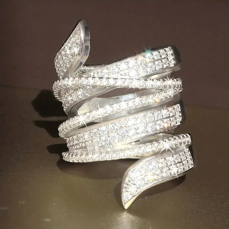 Silver-tone wide multi-row cubic zirconia pave statement ring, curved band design.