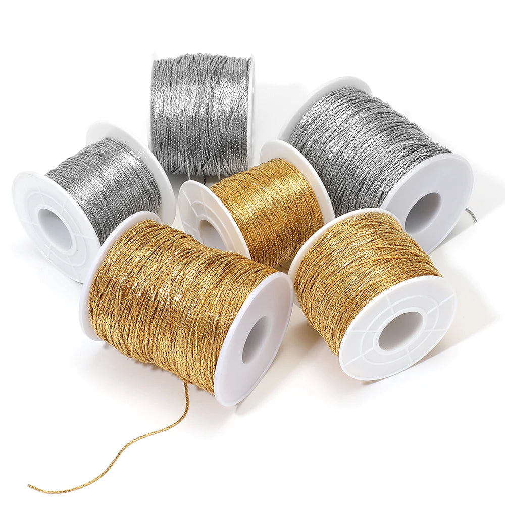 Gold thin wire chain on white spool for DIY jewelry making