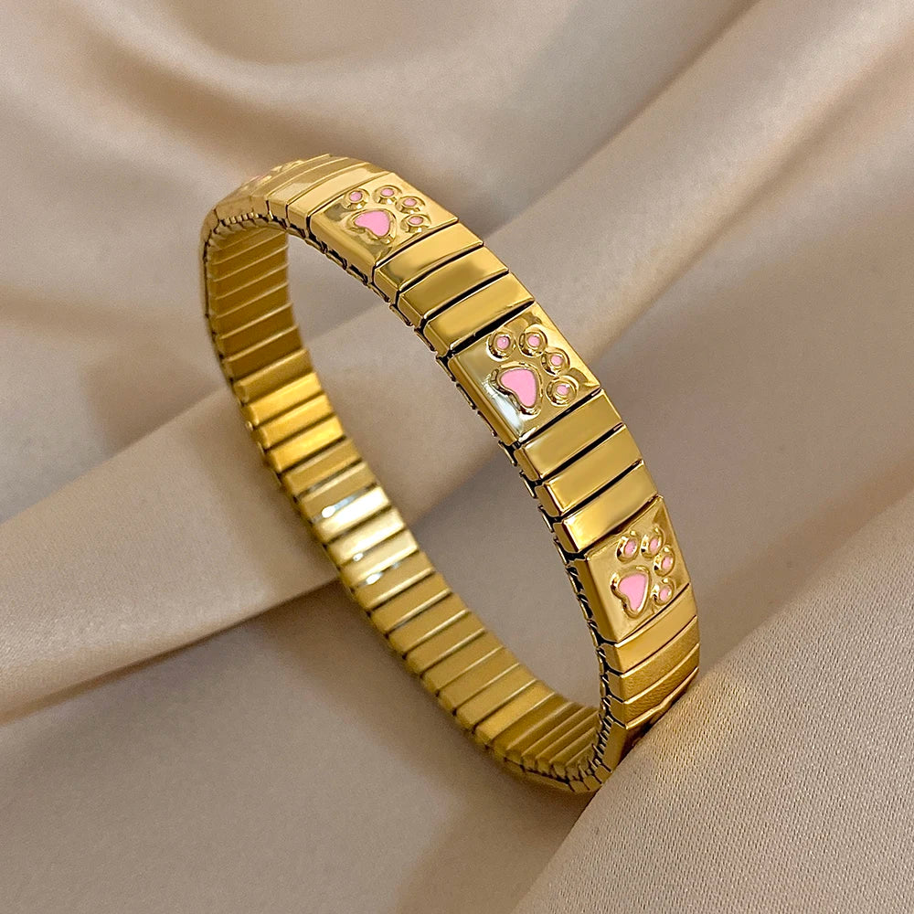 Gold enamel paw print link bracelet bangle, glossy pink paw charms on metal squares.