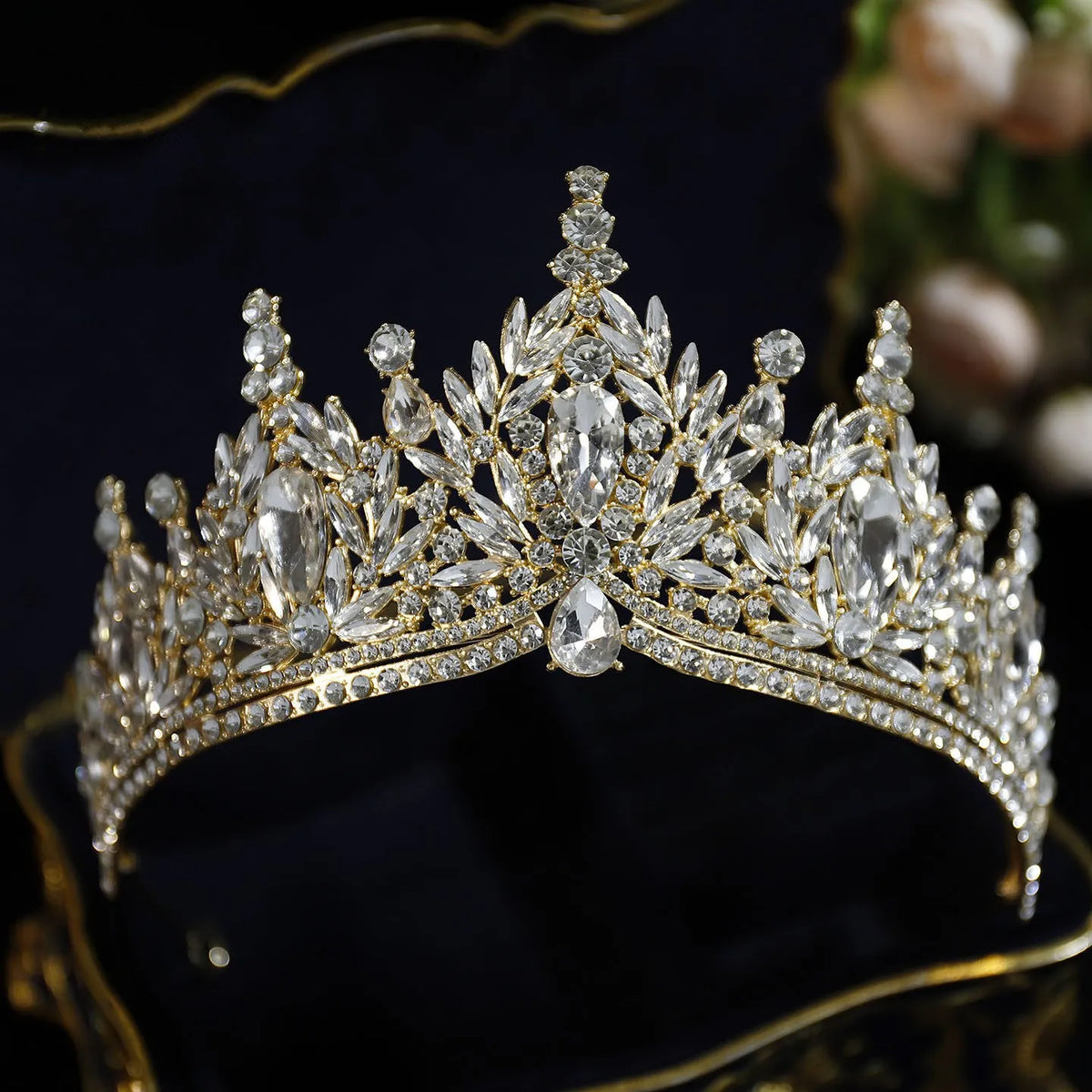 Gold-tone and clear crystal tiara crown with faceted stones and rhinestone band