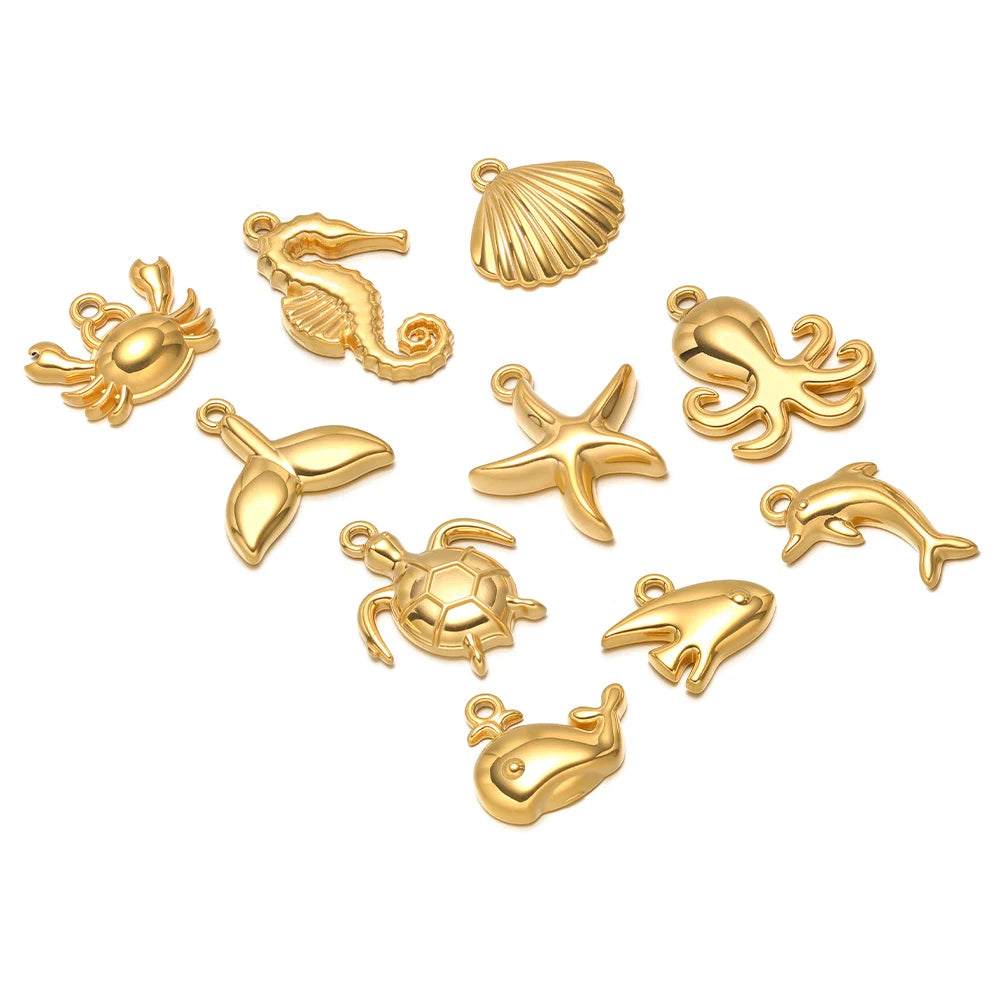 Gold-tone ocean animal pendant charms set, includes starfish, dolphin, crab, shell