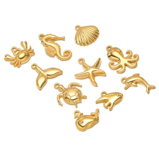 Gold-tone ocean animal pendant charms set, includes starfish, dolphin, crab, shell