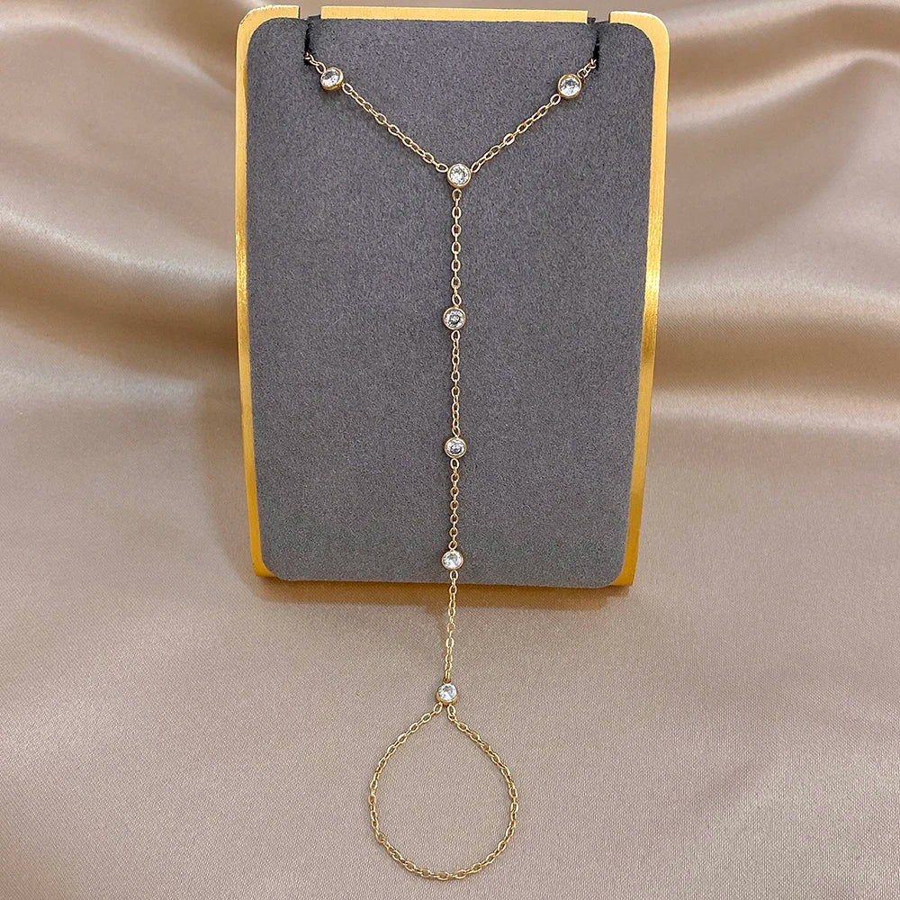 Gold zircon bead link bracelet with round stone drops and adjustable chain loop