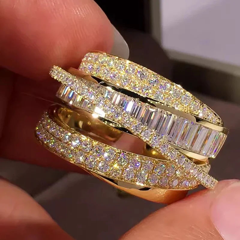 Gold-tone CZ open band ring with stacked sparkle bands and baguette center stones