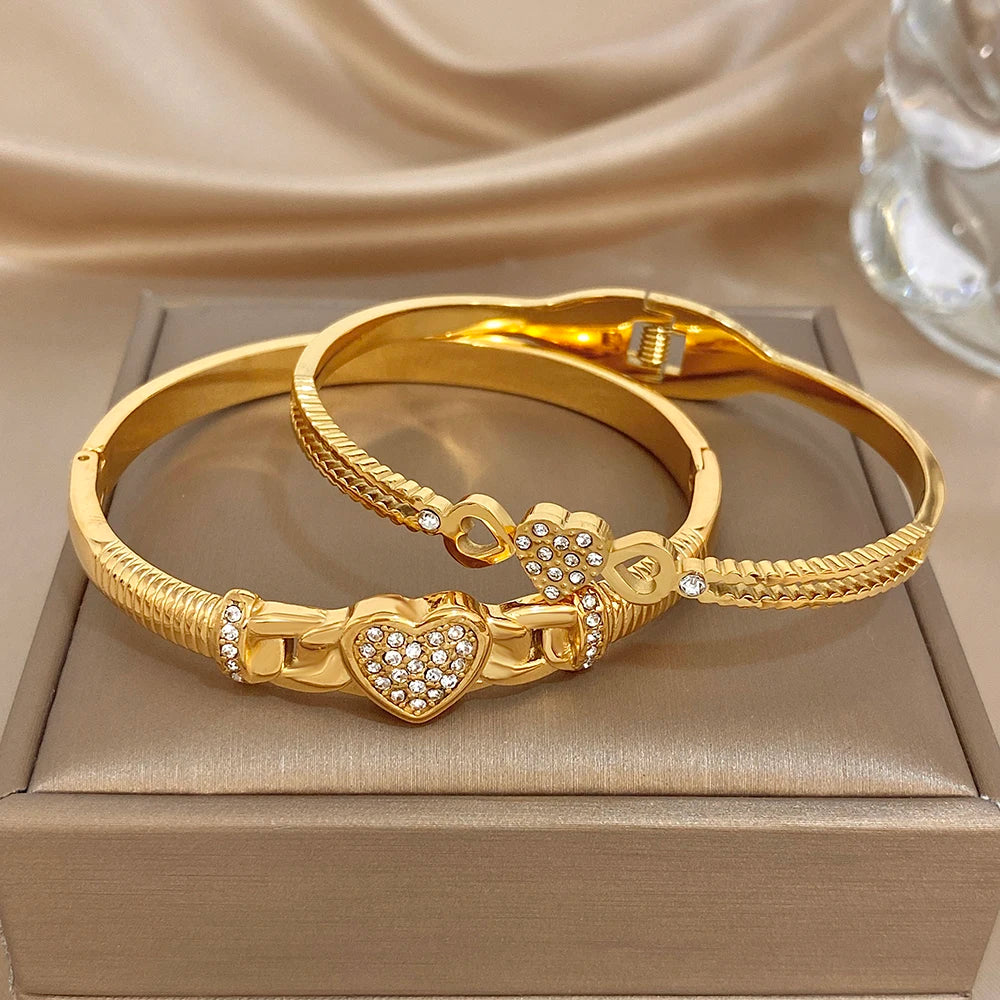 Gold-tone heart and rhinestone cuff bangle bracelet with braided rope texture