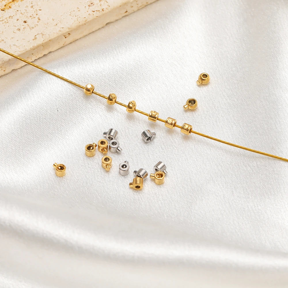 Gold and silver crimp end bead stoppers with beading wire for bracelet making