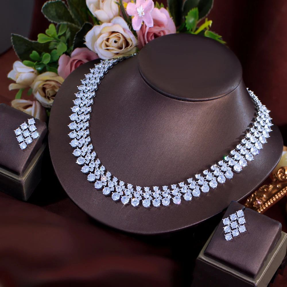 Silver-tone CZ cluster necklace with matching square earrings set on display stand