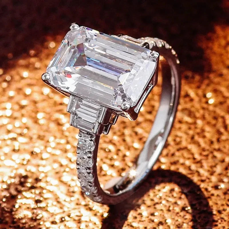Silver zirconia eternity proposal ring with a large rectangular center stone