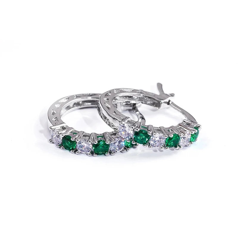 Silver circle hoop earrings with green gemstones and clear stones