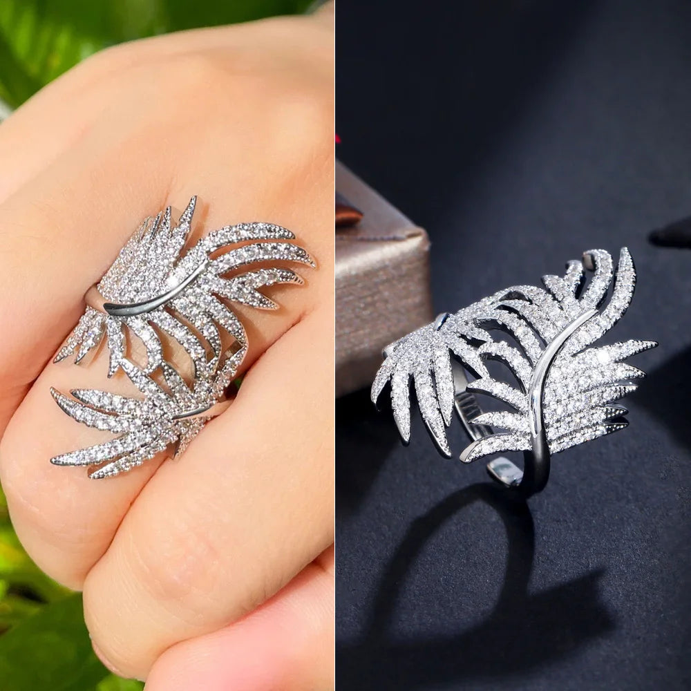 Silver-tone adjustable ring with two feather-shaped sprays set with clear stones