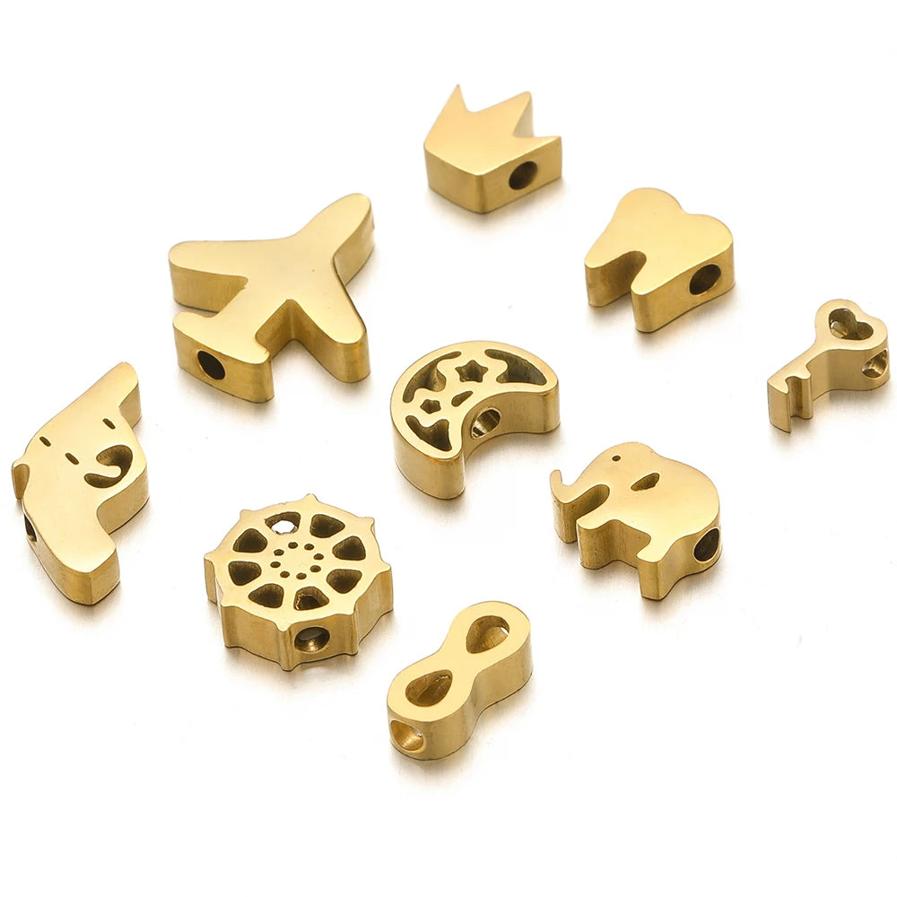 Gold-tone stainless steel spacer beads, assorted animal and symbol shapes with holes